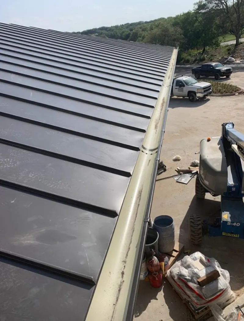 Standing seam panel and gutter detail on a metal roofing jobsite in Taneytown